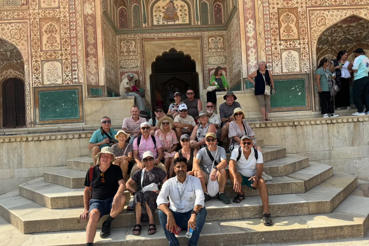 Group of travellers visiting the decorated interiors at Amber Fort