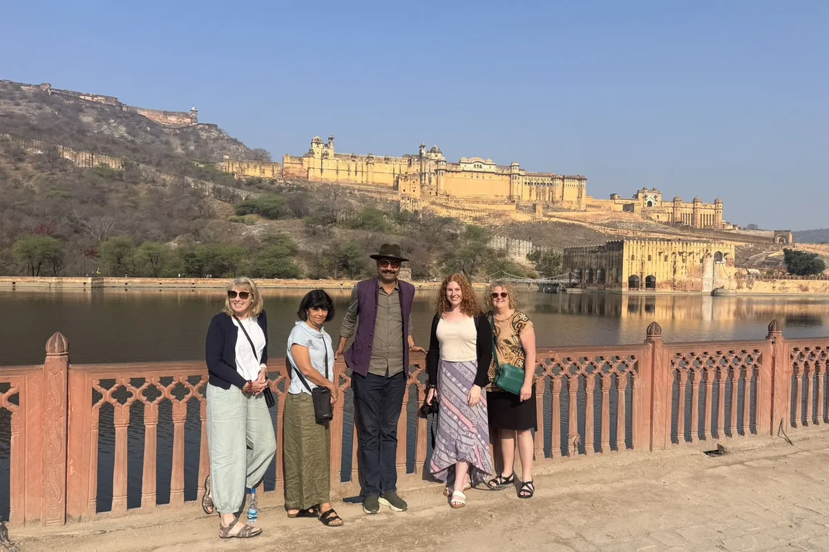Travellers enjoying a view of a historic fort in Jaipur